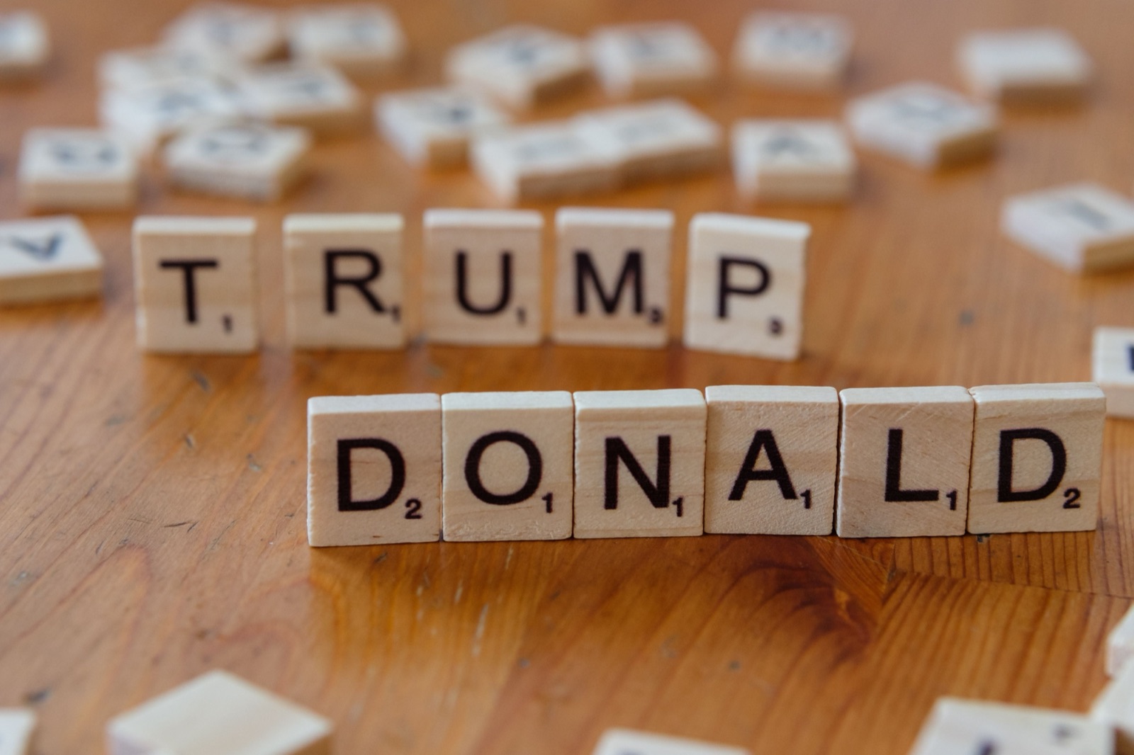 Wooden letter tiles spelling Donald Trump